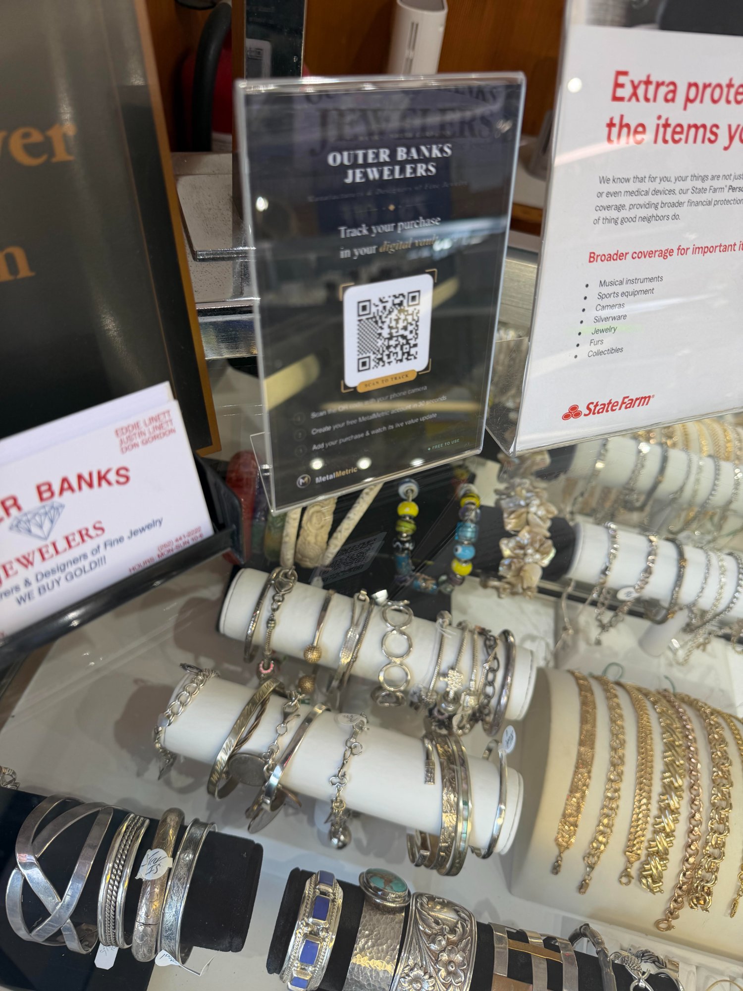 MetalMetric QR placard at Outer Banks Jewelers bracelet display, Kill Devil Hills NC